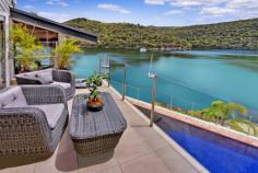 46 Cowan Drive Cottage Point NSW 2084 Price: Expressions Of Interest 1,443 sqm North Facing Deep-Waterfront Dream An exquisite connection of luxury with nature in one of only 52 private residences to exist in one of Pittwater's most exclusive waterfront enclaves which enjoys breathtaking due north facing water and unbeatable Australian bushland panorama to Looking Glass Bay and Ku-Ring-Gai Chase National Park. Cottage Point is one of Sydney's smallest yet most scenic unspoiled foreshore spots but best of all, only a 45 minute drive from your CBD office or city home. Driving distance to Terrey Hills and to Avalon shopping village and not much further Palm Beach restaurants and cafes. An architectural triumph constructed around a spectacular natural feature rock you will soon discover a beautifully designed retreat with immense space, style and comfort. This sophisticated residence on a grand scale has it all – 5 spacious bedrooms (2 with mezzanine lofts), home office, large entertaining decks, elegant timber ceilings, formal dining and informal dining areas and that place to park the water vessel of your desire. Sea plane and ferry spotting may become one of your many favourite things to do whilst looking out from within through the double-height glass sun-soaked windows. Entertaining has never been made easier with a commercial size bar, a spectacular chef's caesar stone benchtop kitchen with Meile appliances and a dining room with romantic views on dusk which simply take your breath away. Perched on the water's edge is a self-contained boathouse with 2 loft bed areas, gas kitchen and bathroom with shower. A private deep-water jetty completes the picture. This entire property has been meticulously renovated with updated kitchen and bathrooms, new plumbing, new electrical systems, and freshly painted both inside and out. Features to note: - 5 bedrooms, 2 with extra mezzanine lofts - Master bedroom with ensuite, walk in robe and views - Separate formal dining and casual living areas with views - Deep 15 metre decked swimming pool, heated spa and bbq entertaining - Self-contained boathouse with bedrooms, kitchen and bathroom - Deep-water jetty , boat winch and inclinator - Level from the street 5-car garage with internal access, plus off-street parking - Back-to-base security with ADT, reverse cycle air conditioning. The close-knit Cottage Point community mostly comprises owner-occupiers and offers a peaceful waterside lifestyle in one of Sydney's tiniest and most beautiful suburbs. For a private inspection, call Gavan Kohen on 0414 911 070. Inspection Times Or By Appointment PROPERTY OVERVIEW Property ID: 1P5814 Property Type: House Building Size: 1443 m² Carport: 5 Aspect: North FEATURES Air Conditioning Built-In Wardrobes Alarm System Pool Water Front Close to Schools Ensuite Water Views Ocean Views Security Access Security System