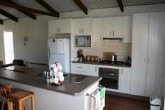 2671 Shannons Flat Rd Shannons Flat NSW 2630 Located approximately 25 kms NNW of Cooma along Shannons Flat Rd set on approx. 260 acres or 107.7 hectares of slightly undulating country boasting some magnificent views towards Yaouk, The Four Mile, Cooma, Nimmitabel alike. Approx. 80% arable and 20% lightly timbered with some pasture improved including Phalaris and Clovers. Well fenced into some 5 main paddocks, with some strategically placed small holding paddocks. Fenced and designed with horses in mind, 6 dams. Comfortable rustic dwelling originally a shearing shed, now converted to a great abode with quality finishes- All approved! Open plan living, combustion fire, huge entertaining deck with northerly aspect, exposed timber beams, modern kitchen and bathroom, large bedroom with built-ins, and NY style laundry, Wunderlich louvre windows, well insulated, gas cooking, infinity hot water and 2 rain water tanks. Garaging for two, workshop, unloading/loading stage and ample storage. All this less than 1.5 hours drive from Canberra or 20 or so minutes from main street Cooma.