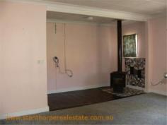 22 Granite St Stanthorpe QLD 4380 $185,000 4 bedroom low set residence Separate lounge Country style kitchen with gas stove & wood stove with wet back hot water system Modernized bathroom with shower Wood burning fire box Large carport at rear plus a store room Rental? - $240 per week return Iron roof, rendered exterior, town water & sewerage Fully fenced ¼ acre allotment handy to town CBD and Quartpot Creek parklands This is a sturdy home with plenty of space and in a handy position. Category House Property ID H2999