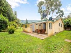 717 The Pocket Rd The Pocket NSW 2483 For Sale Offers over $449,000 Original farmhouse on peaceful 1/2 acre with beautiful permanent creek frontage. High ceilings, 2 formal bedrooms, main with walk-in rob plus a sunroom/3rd bedroom, Large open kitchen dining, big bathroom, 2nd toilet in laundry plus storage room. Very good workshed and additional carport. The land is level, with ample room for market gardens or possible rural dual occupancy. Well established gardens and rainforest trees with terrific wildlife and the creek adds a whole other dimension to the property that will be enjoyed forever. Add your finishing touches and enjoy the country life without the hardwork. Enquire today at offers over $449,000. Features General Features Property Type: House Bedrooms: 3 Bathrooms: 1 Land Size: 1847 m? (approx) Indoor Toilets: 2 Floorboards Broadband Internet Available Outdoor Carport Spaces: 1 Garage Spaces: 2 Shed Eco-friendly Water Tank Other Features Level useable land, flood free block, room to build 2nd dwelling/shed. Currently rented for $390pw