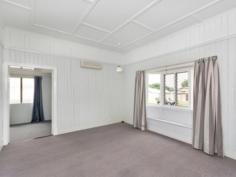 9 Cothill Rd Booval QLD 4304 $329,000 Stunning Bungalow and a Shed A gorgeous Californian Bungalow situated within walking distance to train station, Booval Fair shopping centre and Sacred Heart School. The character and charm is endless in this 1940′s Bungalow with high ceilings, antique light shades and beautiful molded ceilings. French doors with lead light glass separate the lounge and dining rooms and adjacent is the freshly painted kitchen with retro cupboards – it’s like taking a step back in time to the elegance of yesteryear. The perfect home for the First Home Buyer, Investor or Retiree. There are 2 huge bedrooms, the main with bay window and window seat and each bedroom has access to a long sleep-out – perfect to use as a third bedroom, a child’s playroom, study or a sitting room. As well as having a powered lock-up double shed, there is also a double carport and when not is use for car cover, it becomes a spacious outdoor entertainment area for family get-togethers or barbecues. The fully fenced property is on 966 square metres and situated in a quiet street. A light and airy house just waiting for your to make it your home