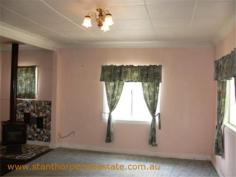 22 Granite St Stanthorpe QLD 4380 $185,000 4 bedroom low set residence Separate lounge Country style kitchen with gas stove & wood stove with wet back hot water system Modernized bathroom with shower Wood burning fire box Large carport at rear plus a store room Rental? - $240 per week return Iron roof, rendered exterior, town water & sewerage Fully fenced ¼ acre allotment handy to town CBD and Quartpot Creek parklands This is a sturdy home with plenty of space and in a handy position. Category House Property ID H2999