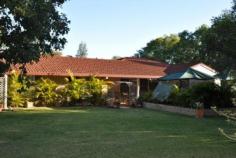 9 Lalor St Roma QLD 4455 FOR SALE $525,000 This spacious air-conditioned brick family home on over 2 acres at Orange Hill is priced to sell! The house comprises four built-in bedrooms (three with northern aspect " main opening to front patio), carpeted loungeroom, spacious kitchen with gas stove and pantry, dining area off kitchen, large rumpus room with wood heater, bathroom with separate bath, shower and vanity, separate toilet and spacious rear laundry/sewing room. Extra improvements include double lock-up shed, double garage, garden shed, outdoor entertaining areas, built-in bbq, split-cycle air-conditioning, gas and electric hot water systems, share bore, pressure pump, rainwater tank, security system, full fencing, automatic front gate and auxiliary power outlet for generator and established lawns, trees and extensive gardens. This is a rare opportunity to secure exclusive acreage living on loamy soils so close to town. Inspection is a must " this property won’t last!