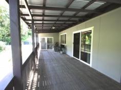 874 Terania Creek Rd Terania Creek NSW 2480 $575,000 Approximately 50 lush acres positioned 10 minutes drive from the beautiful Nightcap National Park and Protestors Falls. Recently renovated 4 bedroom home. The modern, refurbished kitchen includes a butchers bench and five burner gas stove. The kitchen opens out into an airy dining/living area that has polished timber floors and sliding doors that lead out onto beautiful, wide verandahs. There is a private, second dwelling that has been recently renovated and offers self-contained living and privacy from the main house. Huge, undercover area that has enough room for four cars! Tastefully landscaped with a terraced vegetable garden and walking tracks that take in the large variety of fruit trees. Access to your very own, secluded swimming hole positioned on Terania Creek. Photos do not do it justice! Solar hot water, 3x 5000 gallon (total approx 60,000 litres) tanks and mains power. Phone reception and internet available. The acreage has a balance of cleared, elevated areas with views over Terania Creek Valley and beautiful, ancient stands of rainforest. There is also a second creek and dam located on the property. A school bus goes past the front gate. With so much to offer, why not inspect