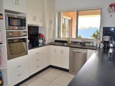 4 Kurrawong Street Temora NSW 2666 $480,000 Brick & 5 Acres Who wants the headache of Building? Call and make appointment today to view this lovely family home, which offers a warm cosy secluded atmosphere. The big plus is the 4 large bedrooms all with BIRs and carpeted. Main bedroom features ceiling fan and ensuite. Kitchen has plenty of cupboard space, pantry, dishwasher and stainless steel appliances- very nice! Laundry tiled with cupboards and folding table. The open plan dining/ lounge room and a bonus of a secluded parents retreat, gives you two family rooms, all rooms have large windows allowing for lots of light. Double garage with storage along on side means less clutter! Workshop with large tank for the garden & lawn. Paved undercover BBQ area. Huge enclosed yard with cubby house for littlies. Must be seen to be appreciated Vendors realistic For Sale $480,000 Features General Features Property Type: House Bedrooms: 4 Bathrooms: 2 Land Size: 2.02ha (5.00 acres) (approx) Indoor Built in Wardrobes Dishwasher Ducted Heating Ducted Cooling Outdoor Remote Garage Secure Parking Garage Spaces: 4 Outdoor Entertaining Area Shed Fully Fenced Eco-friendly Water Tank Inspections Inspections by appointment only