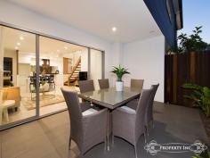 122 Waverley St Annerley QLD 4103 From Offers Over $589,000 An ultramodern design of brand new luxury The cutting edge design of these brand-new townhouses redefines the ultimate in stylish living. Built to the highest standards, striking contemporary architecture by Cunningham Designs offer quality appointed homes that exude style and comfort throughout and boast sleek modern fixtures and fittings. The use of space and light, together with the use of glass and timber create a breathtaking backdrop to the streamlined open-plan living/dining area. Beautifully positioned, these stunning residences soak up north south cross ventilation and reveal an ensemble of deluxe timber and stone finishes. Plush cabinetry and glass finishes throughout a relaxed layout feature a gourmet Kitchen that boasts Miele appliances, Caesar stone benches, under mount Olivieri sink, soft close drawers and 2 pac cabinetry. Each townhouse offers large alfresco terraces that, with their landscaped surrounds, offer a true extension to your living space. The generous bedrooms are gently filled with warming light, and the sleek bathrooms with imported Italian tiles add another level of luxury. Remote garage, hardwood timber flooring, ducted air conditioning and video intercom further complement the design, This boutique development of impeccable new residences, finished to perfection with undeniable quality and luxury, await those with high expectations.