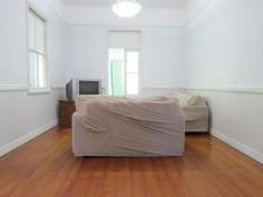 101 Pine Mountain Rd Brassall QLD 4305 379,000 2312m2 (Over half an acre) of fully fenced, shaded tree, spacious bliss located close to the CBD yet only a stroll away from shops, beauty, takeaway, IGA, bus stop, schools and all that you ever need. Be on the Warrego Highway in only a few turns of the steering wheel and when you finish with the hustle n bustle of the outside world…come home and relax in your massive, scenic rear yard paradise! Bring the dogs, trucks, trailers, motorhome or maybe even a granny flat to plonk on this sprawling piece of Australia. The decorative front fence has just had a fresh lick of paint, as has both the internal and external areas of the home. A carport sits at the ready to park the pride and joy beneath and up to 3 small cars can easily park in under the home on the concreted slab, where you will also find the laundry area. The covered front veranda is the place to sit and watch the world pass by and inside you will find timber flooring mostly thoughout, 2 large bedrooms (1 with an adjoining sleepout area that would make a perfect ensuite/walk in robe conversion), a large air conditioned formal dining room (that would easily convert into a 3rd bedroom), an adjoining lounge room that opens into another sleepout that also extends into the supersized dining/family room that features almost a wall of beautiful stained coloured glass windows. A separate study leads out from the dining/family room area, or if you would prefer your laundry to be upstairs…then it’s the place for it! The country styled kitchen is the perfect theme for the surrounding timber tongue & groove walls & ceiling, plus the decorative fretwork. A 12 month old oven takes care of business and you have plenty of room for all you need to do within the kitchen thanks to the large island bench. The bathroom definitely does the job required of it, roof insulation keeps the climate just the way you like it, high ceilings are everyone's favorite, the roof guttering has been upgraded, as has the sewer lines and storm water exit pipes. A garden shed is on hand for the lawn and garden equipment and if that needs servicing….simply walk down to the local mower shop! Features Study Floorboards Shed Fully Fenced
