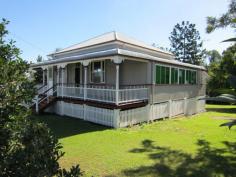 101 Pine Mountain Rd Brassall QLD 4305 379,000 2312m2 (Over half an acre) of fully fenced, shaded tree, spacious bliss located close to the CBD yet only a stroll away from shops, beauty, takeaway, IGA, bus stop, schools and all that you ever need. Be on the Warrego Highway in only a few turns of the steering wheel and when you finish with the hustle n bustle of the outside world…come home and relax in your massive, scenic rear yard paradise! Bring the dogs, trucks, trailers, motorhome or maybe even a granny flat to plonk on this sprawling piece of Australia. The decorative front fence has just had a fresh lick of paint, as has both the internal and external areas of the home. A carport sits at the ready to park the pride and joy beneath and up to 3 small cars can easily park in under the home on the concreted slab, where you will also find the laundry area. The covered front veranda is the place to sit and watch the world pass by and inside you will find timber flooring mostly thoughout, 2 large bedrooms (1 with an adjoining sleepout area that would make a perfect ensuite/walk in robe conversion), a large air conditioned formal dining room (that would easily convert into a 3rd bedroom), an adjoining lounge room that opens into another sleepout that also extends into the supersized dining/family room that features almost a wall of beautiful stained coloured glass windows. A separate study leads out from the dining/family room area, or if you would prefer your laundry to be upstairs…then it’s the place for it! The country styled kitchen is the perfect theme for the surrounding timber tongue & groove walls & ceiling, plus the decorative fretwork. A 12 month old oven takes care of business and you have plenty of room for all you need to do within the kitchen thanks to the large island bench. The bathroom definitely does the job required of it, roof insulation keeps the climate just the way you like it, high ceilings are everyone's favorite, the roof guttering has been upgraded, as has the sewer lines and storm water exit pipes. A garden shed is on hand for the lawn and garden equipment and if that needs servicing….simply walk down to the local mower shop! Features Study Floorboards Shed Fully Fenced