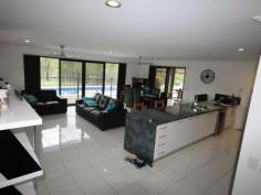 12-14 Paine Pl Kooralbyn QLD 4285 $469,000 ABSOLUTELY STUNNING For those who want the best this is a must to inspect. When you walk in the door you will be impressed by the sheer quality of this home. At one end of the house you have a double size master bedroom with WIR and ensuite with spa bath, a study and a purpose built home theatre room. At the othe end you have 3 double bedrooms, luxurious bathroom, formal dining room or extra office space, laundry and double lock up garage with storage areas and remote access. You will also delight in the gourmet kitchen which adjoins the large lounge and dining area overlooking the inground lap pool and large rear yard with fencing and 2 yards for horses and other animals. Words cannot fully explain the feeling you get from such an impressive home, it has to be inspected to fully appreciate it. Property Snapshot Property Type: House Construction: Brick House Size: 260.00 m2 Land Area: 7,124 m2 Features: Built-In-Robes Ceiling Fans Close to schools Dining Room Dishwasher Ensuite Established Gardens Family Room Fenced Back Yard Formal Dining Room Fully Fenced Yard Garden Shed Gas In-Ground Pool Internal Access via Garage Landscaped Gardens Lounge Outdoor Living Parents Retreat Pool Remote Control Garaging Rumpus Room Security Screens Storage Study Walk-In-Robes