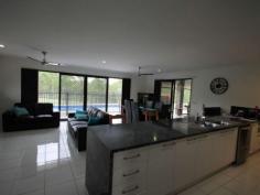 12-14 Paine Pl Kooralbyn QLD 4285 $469,000 ABSOLUTELY STUNNING For those who want the best this is a must to inspect. When you walk in the door you will be impressed by the sheer quality of this home. At one end of the house you have a double size master bedroom with WIR and ensuite with spa bath, a study and a purpose built home theatre room. At the othe end you have 3 double bedrooms, luxurious bathroom, formal dining room or extra office space, laundry and double lock up garage with storage areas and remote access. You will also delight in the gourmet kitchen which adjoins the large lounge and dining area overlooking the inground lap pool and large rear yard with fencing and 2 yards for horses and other animals. Words cannot fully explain the feeling you get from such an impressive home, it has to be inspected to fully appreciate it. Property Snapshot Property Type: House Construction: Brick House Size: 260.00 m2 Land Area: 7,124 m2 Features: Built-In-Robes Ceiling Fans Close to schools Dining Room Dishwasher Ensuite Established Gardens Family Room Fenced Back Yard Formal Dining Room Fully Fenced Yard Garden Shed Gas In-Ground Pool Internal Access via Garage Landscaped Gardens Lounge Outdoor Living Parents Retreat Pool Remote Control Garaging Rumpus Room Security Screens Storage Study Walk-In-Robes