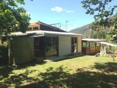 298 Huonbrook Rd Huonbrook NSW 2482 $419,000 Surrounded by lush rainforest and organic fruit trees, this house built with such care and pride has come on to the market for the first time. Part of a Council Approved M.O, this easily accessible 7.5 acres is part of a larger 98 acres with 8 other land parcels. Features include: 2 Bedrooms 2 Bathrooms Artists studio Covered verandas Above ground pool Lush gardens For inspections, please call Dave Bosselmann on 0431 100 097 or Russell Siwicki on 0419 627 109. Features General Features Property Type: House Bedrooms: 2 Bathrooms: 2 Land Size: 3.04ha (7.50 acres) (approx) Indoor Toilets: 2 Study Floorboards Broadband Internet Available Open Fireplace Outdoor Balcony Deck Outdoor Entertaining Area Eco-friendly Solar Panels Solar Hot Water Water Tank