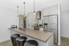 350 Casuarina Way Casuarina NSW 2487 $595,000 Description One of the best priced new homes on the Tweed Coast, located within walking distance to the ocean or Cudgen Creek, comprising an open plan single level design opening out to the north east. Designed to incorporate passive heating and cooling principals, taking the gentle sea breezes and sun light into account. The home features polished concrete floors, solar heating and the outside space to incorporate a perfectly oriented pool or extend the outdoor living space to your own design. Offering 3 bedrooms, 2 bathrooms, 2 car garage with rear access for boat or trailer, European appliances and high end finishes. This home offers a good opportunity for a first home buyer, investor or somebody looking to down size to acquire a very well priced home. Opportunity is knocking – Vendor looking for offers!!! • Single level 3 bedroom, 2 bathroom, 2 car garage (with drive through access). • Polished concrete to the lounge, kitchen, & dining area • North facing indoor & outdoor areas • Cross flow ventilation to all rooms • Carpet to bedrooms • 5,000 litre rain water tank • 340 Ltr Rheem Lo Line Solar – Electric boost hot water • Energy efficient lighting & fans in all bedroom & living rooms