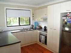 28 Beelong St Macleay Island QLD 4184 $339,000 Water Views, 3 Bedrooms, Beautiful Beelong Street! This quality high-set is a much-loved family home with lovely water views across to Stradbroke Island. Positioned on a big 1,050 m2 block in sought-after Beelong Street, this property is very handy to water access and is loaded with features including: * Spacious open plan living and dining flows to covered outdoor living area * 3 built-in bedrooms, main with walk-in robe and sliding door to front deck * Roomy kitchen with breakfast bar, electric cooking and pantry * Relaxing covered front veranda with good water views to Straddie * Family bathroom features bathtub and separate shower, plus separate toilet * Fully concreted underneath with good height and plenty of potential * Large laundry/store room and an extra toilet downstairs * Big concreted and decked outdoor living areas downstairs * Single garage plus multi vehicle parking potential underneath * Generous 1,050 m2 block, nicely landscaped like the Botanic Gardens * Excellent position on waterfront street near north-eastern tip of Macleay This quality family home is beautifully presented and features extras like ceiling fans throughout, polished timber floors, security screens, the list goes on. Downstairs has excellent height and is fully concreted, with obvious development potential as a toilet and laundry are already in place. There is plenty of room for a workshop area, boat and trailer, etc., and it would be relatively simple to create self-contained living downstairs for guests or extended family. The back yard is a gardener's delight, with a profusion of plants and shrubs giving a great tropical atmosphere. Beelong Street is a beautiful part of the island, catching the prevailing breezes and with picture postcard views to Stradbroke Island. The sheltered swimming area at Pat's Park is nearby, and excellent boat ramp facilities at Dalpura Beach are also just a couple of minutes away. Access to the waterfront via a block of Council land is less than a minute's walk down Beelong Street. This would be an idyllic place to enjoy our unique island lifestyle, and Macleay Island has so much to offer, with a friendly country town atmosphere, fast reliable ferries and with shops, parks, clubs and essential facilities here on the island and ready for you to enjoy. For more information or to arrange your inspection and free pick-up from the jetty, please contact the listing agent. Property Snapshot Property Type: Water Views (some) Construction: Hardiplank Land Area: 1,050 m2 Features: Built-In-Robes Decking Dining Room Fully Fenced Yard Landscaped Gardens Lounge Outdoor Living Polished Timber Floors Security Screens Undercover Entertainment Area Verandah Walk-In-Robes Waterview