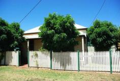 70 Simpson St Wellington NSW 2820 $129,500.00 Property Description Home or investment with classic appeal ! Appealing from the outside highlighted with its bullnose and timber verandah plus picket fencing, this Gem awaits your inspection. This property also boasts an enormous garage that would also make an ideal workshop with access from the rear lane. Inside you will find that the home has plenty of architectural style from the period from high pressed metal ceilings and timber floors. There are 3 good-sized bedrooms, large formal loungeroom with a fireplace that is highlighted with exposed brickwork, dining room and modern styled kitchen. The bathroom has exposed floorboards that have been incorporated with floor tiles to create an impressive visual effect. With some T.L.C this home can shine once again without too much effort. This home is set on land some 518 square metres in area with plenty of potential to improve the yard with further landscaping & garden beds. It is currently leased for $185 per week as at 9 January 2014. Images reflect properties at the time when the photos were taken. Seasonal changes & maintenance can affect the current presentation and prospective purchasers are urged to use them as a guide only. Property Features Land Area 518.0 sqm