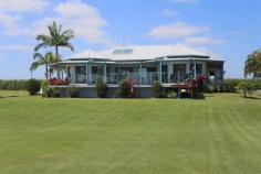 797 Yamba Rd Palmers Island NSW 2463 “Riverview” A Sense of Place, River and Awe Swing off the highway a little north of Grafton, and head towards the coastal village of Yamba. You will find this special home on the river a 10 minute drive from Yamba’s famous beaches. Tucked away off a private laneway, the home has been designed to take full advantage of the river vistas, providing the owners with the ultimate idyllic lifestyle. The current owners are reluctant to leave the home they have created, which has served them and their family well, improving their lifestyle. Constructed in 2000, the spacious design incorporates elements such as 11 foot ceilings and covered decks off all the living areas and bedrooms. The open plan living area is north facing, capturing the views from large sliding glass doors beyond the deck and swimming pool, over the immaculately groomed gardens to the river. A major contribution to the lifestyle factor of this home is the impressive kitchen. With solid central island workstation, large wine rack, airconditioning, gas stove, electric oven, dishwasher, double sink and range hood, all stainless steel, oak cabinetry, and practical saucepan drawers. This area extends to the dining room, which overlooks the pool and river. The addition of the leadlight ceiling feature, is reflective of the mood of the river surrounding this property. The living areas in this home flow seamlessly out onto the covered front deck, the perfect spot to relax with friends and family on hot summer afternoons, and enjoy a BBQ or a pool party while taking in the calming views of the mighty Clarence River. The master bedroom provides spacious walk in robe, and large ensuite bathroom with corner spa, vanity shower and loo. Two of the remaining three bedrooms, have built-in robes, and the largest fourth room would serve as a bedroom or recreational room for the family. The home is complete with double lock up remote control garage. Not only does this property provide a stylish home with all the modern comforts, there is an established clothing and embroidery business in the 9 x 6m airconditioned shed, serviced by its own shower, loo and office. An opportunity exists for the astute purchaser to utilise this approved facility to have the convenience of working from home. All equipment for the existing business is available for negotiation and the opportunity exists to build on this existing business. The current owners have stated that due to ill health they have not been able to take this business to its full potential. There is so much more to this property, it simply must be inspected to be appreciated. A unique opportunity to purchase a beautiful home on the Clarence River, an income, an entire lifestyle all in one, this property has it all. Contact the exclusive marketing agents, Yamba Iluka Real Estate on 6646 2400 to arrange your private viewing today. Property: House Bedrooms: 4 Bathrooms: 3 Parking: 2 Land Size: 20680 Sqm Pool: Yes Council: Clarence Valley