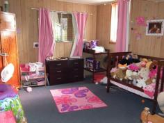 293 Albert St Maryborough QLD 4650 $269,000 5 Bedrooms 2 Kitchens and Loads of Room If your looking for a duelled residence that's close to town then you will find this home worth inspecting. Downstairs, which is constructed from bricks, opens from a veranda with gated access and presents a large carpeted lounge, practical kitchenette, bathroom, toilet, laundry and two large bedrooms. Ascending a lovely timber staircase the upstairs residence has three bedrooms, large open plan lounge and dining, family bathroom with separate shower, bath and separate toilet. Kitchen is all electric, dishwasher, cupboards and ample bench space. Back deck for entertaining. Timber panelling, sash windows, fans throughout with security screen doors. Two bay garage with lane way access, whirly birds to extract hot air, established grounds and planting. Solar hot water. Easy maintainable 539m2 block. Priced for your consideration at $269,000neg