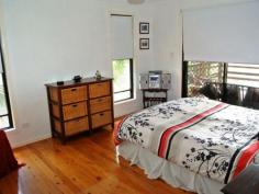 28 Beelong St Macleay Island QLD 4184 $339,000 Water Views, 3 Bedrooms, Beautiful Beelong Street! This quality high-set is a much-loved family home with lovely water views across to Stradbroke Island. Positioned on a big 1,050 m2 block in sought-after Beelong Street, this property is very handy to water access and is loaded with features including: * Spacious open plan living and dining flows to covered outdoor living area * 3 built-in bedrooms, main with walk-in robe and sliding door to front deck * Roomy kitchen with breakfast bar, electric cooking and pantry * Relaxing covered front veranda with good water views to Straddie * Family bathroom features bathtub and separate shower, plus separate toilet * Fully concreted underneath with good height and plenty of potential * Large laundry/store room and an extra toilet downstairs * Big concreted and decked outdoor living areas downstairs * Single garage plus multi vehicle parking potential underneath * Generous 1,050 m2 block, nicely landscaped like the Botanic Gardens * Excellent position on waterfront street near north-eastern tip of Macleay This quality family home is beautifully presented and features extras like ceiling fans throughout, polished timber floors, security screens, the list goes on. Downstairs has excellent height and is fully concreted, with obvious development potential as a toilet and laundry are already in place. There is plenty of room for a workshop area, boat and trailer, etc., and it would be relatively simple to create self-contained living downstairs for guests or extended family. The back yard is a gardener's delight, with a profusion of plants and shrubs giving a great tropical atmosphere. Beelong Street is a beautiful part of the island, catching the prevailing breezes and with picture postcard views to Stradbroke Island. The sheltered swimming area at Pat's Park is nearby, and excellent boat ramp facilities at Dalpura Beach are also just a couple of minutes away. Access to the waterfront via a block of Council land is less than a minute's walk down Beelong Street. This would be an idyllic place to enjoy our unique island lifestyle, and Macleay Island has so much to offer, with a friendly country town atmosphere, fast reliable ferries and with shops, parks, clubs and essential facilities here on the island and ready for you to enjoy. For more information or to arrange your inspection and free pick-up from the jetty, please contact the listing agent. Property Snapshot Property Type: Water Views (some) Construction: Hardiplank Land Area: 1,050 m2 Features: Built-In-Robes Decking Dining Room Fully Fenced Yard Landscaped Gardens Lounge Outdoor Living Polished Timber Floors Security Screens Undercover Entertainment Area Verandah Walk-In-Robes Waterview