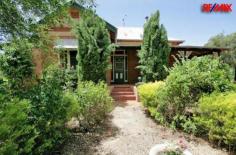 408 Marrar Road Downside NSW 2650 Price $549,000 SPARKLING POOL - CHAMPAGNE LIVING 'Kiaora' - Federation Circa 1910 is positioned on 5 acres just 4km up the Marrar Rd and approx. 15 minutes out of Wagga. This 100 year old fine vintage residence beams with colossal charm and federation qualities that are truly outstanding. Simply irresistible, this resort - like residence in the middle of rolling countryside makes privacy absolute and presents a lifestyle of country charm. With an impressive central hallway, high cedar ceilings, wood fires, ducted cooling and stained glass windows, this is only the beginning! Filled with personally, you'll be invited through stunning brick walls that have stood the test of time. The key is the kitchen which is designed for a creative cook, which shines with style and practicality. Formal and informal light filled living areas of exceptional proportions provide a continuous flow of space for your family. Commanding master bedroom with a large en-suite with spa plus a main bathroom that's distinctly unique... Entertain your family and friends in a relaxing undercover area, which overlooks a magnificent in ground salt pool. The ultimate outdoor experience with a romantic winding garden full of surprises which changes with the seasons. Versatility is another merit with a completely self-contained granny flat with 1 bedroom and 1 bathroom providing endless options for a growing family. A great carport, which will house 4 cars plus powered shedding for the man of the house. This rural princess is a residence of great character and offers a unique flavor that you'll fall in love with! Property Features Property ID 12024423 Bedrooms 5 Bathrooms 3 Garage 4 Land Size 5 Acre approx