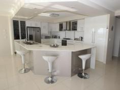 117 Cove Blvd River Heads QLD 4655 $579,000 Hard To Beat It would be hard to find better than this beautifully designed and presented home. Enter through the impressive timber and glass door into the feature entrance hall that leads to open plan living and a modern 2-pac kitchen which has gas cook top and range hood, electric oven, twin dishwasher and stone worktops. The dining and family area has sweeping views of Fraser Island and there is a separate media room complete with surround sound system. 4 good sized bedrooms, the master having an extra large ensuite, walk in robe plus sliding doors leading to a private terrace with ocean views. The family bathroom has the wow factor with stylish fittings and stone top vanity. There is a good size laundry with plenty of storage. From the living area there are sliding doors to the large undercover entertaining area - a perfect place to relax and watch the sun go down. A landscaped 2000m2 block with large 7x12m shed with power, light, shower and toilet plus a 2.7m high roller door - ideal for boat or caravan. There is also a double garage to the home with seamless flooring. The home has 1.8kw solar panels and a gas hot water system. Don't delay, phone today to arrange a viewing. Property Snapshot Property Type: House Features: Ensuite