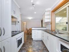 49 Klingberg Dr North Haven SA 5018 $419,000 3-4 Bedroom Home Family Home with space for Cars, Caravan or Boat Nice and Neighbourly ~~ WHAT MORE COULD A FAMILY WANT! * Classic cream brick home with lovely manicured lawns, low maintenance, spacious and extremely welcoming. On a generous 630sqm block, there's plenty of scope here to spread out or even extend (STCC). * 3-4 good sized bedrooms are on offer, with sliding built in robes in master & second bedroom. Split cycle A/C in master bedroom ensures your comfort. Large carpeted lounge also boasts a split cycle air conditioner with ducted evaporative cooling throughout the property. Separate meals area adjoins the kitchen & opens out to the outdoors. Remodelled kitchen is a real star in this home, gleaming in moulded white cabinetry and black countertops. A breakfast bar, double sink and extensive storage makes the room perfect for the demands of family life. * An enormous covered carport and separate double garage means plenty of room for your vehicles, or convert the latter into a separate retreat of your very own. Expansive front lawns offer room to play, while paved areas at the rear mean even more space. With a gabled pergola letting in filtered light, the immaculately maintained space is ideal for al fresco entertaining. * Just 700 metres (approx) to the beautiful Gulf St Vincent marina and near the North Haven train line as well as shops and buses along Lady Ruthann Drive, the home enjoys a tranquil outlook as well as convenient commuting opportunities. Perfect for families and singletons alike, here's a great opportunity to buy a solid home on a well maintained block. * Four bedrooms * Generous lounge * Split cycle air conditioning * Immaculate modern kitchen * Manicured gardens * Outdoor entertaining CONTACT: ROSALIE GRICKAGE 0419 032 042 **RLA123460 ID: 324385 Land Area: 630 m²