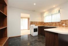 16 Basedows St Happy Valley SA 5159 UNDER OFFER: $320,000 Property Description Just like Neighbours only Happy Valley! FIRST OPEN INSPECTIONS THIS SATURDAY 1:00PM – 1:45PM AND SUNDAY 4:00PM – 4:45PM * Built in 1982, this charming home with many of its original features will appeal to first home buyers, investors, or those wanting to downsize. Entering the home, you are greeted by a light filled foyer with slate flooring and indoor garden. With two living areas, this is quite a spacious home. The formal lounge and dining areas are carpeted and enjoy double aspect windows that allow light to flood into the room. The casual living and meals feature slate flooring throughout into the kitchen area. The kitchen itself offers a fair amount of workspace, but has scope to be extended. With a nice wide hallway leading down to the bedrooms, bathroom and laundry, it doesn’t feel enclosed and gives a sense of space. The main bedroom has built-in sliding robes and a large window. The two other bedrooms are of a good size with the third bedroom allowing space for a cupboard, or study nook. With the wet-areas conveniently located at the rear of the home, the large bathroom has a separate toilet and the laundry allows you access to the back garden. Complimenting the kitchen and meals area is the outdoor paved pergola. With a manageable sized front and rear garden (which is fully fenced), off-street parking for up to four cars (including the single carport) and situated in a quiet street amongst other quality homes, this home will sell at this affordable price. Property Features Building / Floor Area 121.0 sqm Land Area 596.0 sqm