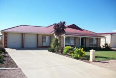 11 Bollmeyer St Wallaroo SA 5556 $479,000 SUPERB FAMILY HOME House - Property ID: 728929 This impressive family home is situated in one of Wallaroo's most popular estates and is ideally designed for the growing family. Convenient to the Wallaroo Hospital, boat ramp and shopping facilities the home is set on a large 919m2 allotment with an approx 31m street frontage. A quality brick veneer home with four bedrooms and two living areas it has 10' high ceilings providing an immediate sense of spaciousness. All bedrooms are large, the main with WIR and ensuite and the other three with BIR's. A stunning modern kitchen with glass splashbacks and the wonderful convenience of a huge L-shaped walk-in pantry looks out into the generous family/dining area, all comforted by reverse cycle split system air conditioning. Not only is there a double garage and store/workroom under the main roof with direct access to the house, but you also have a separate 20' x 30' x 10' Colorbond garage with concrete floor and power. The outdoor undercover entertaining area is complemented by an easy care yard with full Colorbond fencing. Four rainwater tanks (totalling 21,000 litres) and 3.2kwatt solar panels make this home an energy efficient and cost effective property. Why build when you can buy quality such as this? Take advantage of the great opportunity offered here to purchase your first home, or to upgrade in style. To view the property or for further information please contact Ian Adams on 0427 112 668