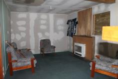 60-62 Esplanade Queenstown TAS 7467 $35,000 Property Information Cottage on two blocks. Just what the renovator is looking for. Some of the hard work is done. Lounge has pure heat wall heater for warmth while renovating. Kitchen complete with stove. Bathroom has been renovated with tiled floor, new shower, vanity and ceiling heating. New toilet. Some of the new cladding has been done but plenty of scope to add your own touch. Great workshop with character which will come in handy for storing tools for the renovation. Spare block of 376sqm for gardens or chooks. With some hard work you could own your very own. Call to discuss further or to organise inspection. Land Size 610 sqm Property condition Renovator Property Type House House style Cottage Garaging / carparking Off street Construction Timber and Cladding Joinery Timber Roof Iron Walls / Interior Panel sheeting Flooring Carpet, Other (Vinyl) and Timber Window coverings Drapes Heating / Cooling Electric Chattels remaining Fixed floor coverings, Light fittings, Stove, Curtains Kitchen Original and Upright stove Living area Separate living, Separate dining Main bedroom Double Bedroom 2 Double Main bathroom Separate shower, Heater Laundry Separate Workshop Separate Views Urban Fencing Partial Land contour Flat Grounds Overgrown Water heating Electric Water supply Town supply Sewerage Mains Locality Close to shops, Close to schools