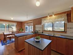 595 Native Corners Rd Campania TAS 7026 $365,000+ Charming Country Living With winter on the way, are you looking for a cosy country home where you can snuggle in front of the fire? You'll love coming home to your own sweet rural retreat. Only 35 minutes from Hobart and set on about 5 1/2 acres of low maintenance cleared land, this lovingly maintained home is perfect for the homebuyer who longs to get away from it all without breaking the budget. This home has a welcoming feel to it that makes you want to linger. Upon entering, you'll notice the wood heater in the lounge has been placed against an inside wall, ensuring it heats the whole house. Attractive windowed doors with decorative glass can be closed to separate the two living areas. The main lounge window looks out onto the nearby hills and valleys that are so flawless it is like having a beautiful painting on your wall. The kitchen inspires visions of home cooked meals, mouth-watering casseroles and roasts. There is lots of pantry space and a kitchen island for extra bench space. A bay window in the generous dining area adds charm and gives a resplendent view of the hills and yard, complete with adorable gazebo, swaddled in fragrant geranium. Toward the back of the house is the bathroom and with its deep tub and decorative glass window you are sure to be enticed into many a relaxing bubble bath. The laundry is practical and functional with good cupboard space. Surprisingly spacious yet still having an intimate feel, this home has been cleverly designed to have separation between the master bedroom and the other sleeping quarters, ideal for families who appreciate their own space and privacy. Two cosy bedrooms are at one end of the hall and get good sun. Both have built in robes. The inviting master bedroom at the far end of the hall is much larger and has a sizeable built in robe plus views from the generously size window. You can lie in bed and take in the scenery upon waking. The property also has a large colourbond workshop/garage, raised garden beds out the back for growing your own vegies, a garden shed plus three huge water tanks. Further up the hill is a barn/woodshed. To complete this idyllic country home, a covered Verandah runs all the way around the house, with a deck placed off the second living area. This area is perfect for outdoor entertaining with friends on warm summer evenings or a place to cosy up with a loved one, share a bottle of wine and marvel at the stars. Underneath the deck is a storage area. By the way, this house with its sunny aspect and inviting feel will draw all your friends in and it is likely you will have friends and family dropping by all the time. It's just that kind of place. Call Aaron or Helen now to secure your private inspection time. Property Snapshot Property Type: House Aspect Views: Mountain Construction: Brick House Size: 147.00 m2 Land Area: 5.50 acres Features: Built-In-Robes Decking Gazebo Heatpump Rumpus Room