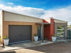 1/20 Market St Eaglehawk VIC 3556 Upmarket on Market There's bound to be a lot of frenetic activity on August 15 when this low-maintenance property goes to auction. Ideal for investors, first-home buyers or retirees, it has all the hallmarks of a modern inner-city pad without city rates, etcetera. You can walk around the corner to the railway station, over the bridge to the shops and Star Cinema and across the road to the tennis courts where apparently they have fabulous afternoon teas. The owners love the neighbourhood and the crown land outlook next door. The angled roofline and brick and rendered faade, give the dwelling a contemporary look. Two bedrooms, two bathrooms, an open-plan kitchen, dining and living area, European laundry and separate toilet are all wrapped up in brilliant white walls and ceilings with just a splash of colour in the tastefully decorated bathrooms, the coffee-coloured porcelain tiled floors and the luxurious charcoal carpet in the bedrooms and living area. Clerestory windows in the living area draw in light and sunshine while giving privacy, while north-facing windows with a sliding door opening to undercover entertaining, shower the kitchen and meals area with light. Stainless steel gas appliances combine with a sleek Bosch dishwasher in the kitchen and there's a handy breakfast bar for quick snacks. The main bedroom has a reverse-cycle split-system, (one of two) ceiling fan, built-in wardrobes and a 1200mm x 900mm shower with a rainfall showerhead in the en suite. A similar showerhead is also in the three-piece bathroom. Built-in wardrobes and a ceiling fan are in the second bedroom. A single garage with a remote control roller door, open shelving, internal and backyard access, completes the package. The outside is concreted with a rainwater tank plumbed to the toilet. Be sure to inspect soon.