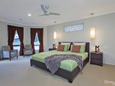 35 The Pkwy Pakenham VIC 3810 $420,000 Sun Drenched Family Home – Lakeside Inspection Times: Sat 04/07/2015 12:30 PM to 01:00 PM Relax, entertain or play, it's all here... Be quick to view this outstanding family focussed home in the prestigious Lakeside estate. Sitting proudly on this 600SQM approx block is this enchanting 4 bedroom home offering 27SQ's approx (URL) and plenty of space for all to enjoy. The country style street appeal is only enhanced with a front verandah and plantation shutters. The welcoming entrance forms part of the 7.0m x 4.7m front living room, ideal for all your family entertainment needs. The second living space is open plan so also offers a dining area and large kitchen. Appliances include a dishwasher, under bench oven and gas cook top, with plenty of cupboards and a walk in pantry to satisfy your storage needs. This naturally light filled part of the home then leads seamlessly outside to the main verandah, gardens and play area featuring a sandpit and swings. The master bedroom is just that, spacious, sunny and inviting with a WIR and ensuite, a sanctuary you won't want to leave. The second bedroom also features a WIR making it perfect for a teenager, while the third has a freestanding robe and the fourth a BIR. The long list of extras includes a double remote garage with rear roller door, GDH, Evaporative cooling, energy saving LED lighting throughout, a small shed and a programmable irrigation system for easy garden maintenance. A true family home to be enjoyed so don't miss out!