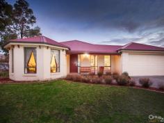35 The Pkwy Pakenham VIC 3810 $420,000 Sun Drenched Family Home – Lakeside Inspection Times: Sat 04/07/2015 12:30 PM to 01:00 PM Relax, entertain or play, it's all here... Be quick to view this outstanding family focussed home in the prestigious Lakeside estate. Sitting proudly on this 600SQM approx block is this enchanting 4 bedroom home offering 27SQ's approx (URL) and plenty of space for all to enjoy. The country style street appeal is only enhanced with a front verandah and plantation shutters. The welcoming entrance forms part of the 7.0m x 4.7m front living room, ideal for all your family entertainment needs. The second living space is open plan so also offers a dining area and large kitchen. Appliances include a dishwasher, under bench oven and gas cook top, with plenty of cupboards and a walk in pantry to satisfy your storage needs. This naturally light filled part of the home then leads seamlessly outside to the main verandah, gardens and play area featuring a sandpit and swings. The master bedroom is just that, spacious, sunny and inviting with a WIR and ensuite, a sanctuary you won't want to leave. The second bedroom also features a WIR making it perfect for a teenager, while the third has a freestanding robe and the fourth a BIR. The long list of extras includes a double remote garage with rear roller door, GDH, Evaporative cooling, energy saving LED lighting throughout, a small shed and a programmable irrigation system for easy garden maintenance. A true family home to be enjoyed so don't miss out!