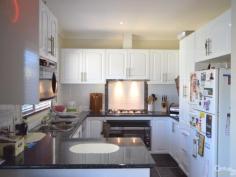 17 Parmentier Way Pakenham VIC 3810 $440,000 Magnificent Home AND Top Location! Inspection Times: Sat 04/07/2015 02:00 PM to 02:30 PM Family friendly location just a stroll to Lakeside Primary School and walking distance to 926 bus, Cardinia Road Train Station, St Francis Xavier College, parks, shops and sporting facilities and with easy access to the major freeways. This magnificent double storey home sits high and proud in a lovely street amongst other quality homes and has all the bells and whistles to make life that much more enjoyable! Upstairs boasts 2 good sized bedrooms with built-in-robes as well as modern family bathroom, downstairs is the air conditioned master bedroom with walk-in-robe and full ensuite bathroom, 4th bedroom (or home office/study), separate lounge, generous open plan living room and dining area adjoining light & bright kitchen with 900mm cooktop and oven, as well as dishwasher. Ducted heating and 3 split system airconditioners take care of year round comfort. Extra features include timber venetians, polished wood flooring, gloss tiling to wet areas, down-lighting and neutral tones throughout. Central vacuuming system makes cleaning a breeze and security cameras and full alarm system give you peace of mind. Paved outdoor entertaining area set in low maintenance gardens and a double remote garage with internal and rear access completes this very impressive package!