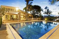 17 Crystal Waters Drive Tweed Heads NSW 2485 Offers Over $1.4mil Quality, Style & Position!This absolutely immaculate executive residence is guaranteed to impress. Quality, Style & Position! 17 Crystal Waters Drive Tweed Heads This absolutely immaculate executive residence is guaranteed to impress. Surrounded by mature trees and gorgeous landscaped grounds the timeless design belies the age of this luxurious waterfront residence. 4 bedrooms, 3 bathrooms + powder room 4 car garage + off street for 3 more Rare double block: 1605m2 Residence internal 439m2 external 97m2 (58 squares) Sparkling fully tiled inground pool and full sized floodlit tennis court Large study or media room Solid brick and raft slab construction Double door entry foyer with a Zen Garden Double front doors open to a spacious foyer which features a welcoming Zen Garden, internal access to the garaging, powder room, stairway leading upstairs and access to the main living rooms. The gourmet kitchen is fully equipped with Smeg S/S appliances, the adjoining family area flows to a covered sandstone tiled patio overlooking the sparkling, private swimming pool and fully lit, full size tennis court. The split level formal dining and lounge rooms feature a soaring two story high ceiling. Upstairs has 3 queen size bedrooms which have their own bathroom and chillout zone, two have adjoining balconies which overlook the water. All have built in robes. Also on this level the multi story design features a mezzanine walkway which overlooks the formal lounge and dining rooms and leads to the lavish master bedroom suite. The master features an ensuite with spa and separate shower, a large walk in robe and a breezy private balcony overlooking a wide expanse of the Terranora inlet. Multiple alfreso living areas for capturing the best of every day, in every season and a fully weather proof barbeque make this home an entertainers heaven. Water on both sides of the residence, canal one side and an expansive section of Terranora inlet on the other. The canal front feaures a pontoon mooring as well as a unique underground boatshed built into the building's foundation. Easy access to Tweed River and ocean for a large cruiser. This unique home was years ahead of its time when built and still represents advanced concepts of form and function. A true blend of classic beauty and timeless elegance. A two storey home of size and distinction with many extra features in a highly sought after waterfront location. Magnificent, modern, high quality construction. What a position, what a home! Offers over $1.4mil Private inspections by appointment with exclusive marketing agent Richard Carter 0413 543 157