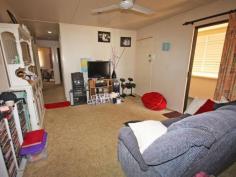 22 Don St Biloela QLD 4715 $190,000 Fantastic Investment Opportunity - Current Gross Return 7.9%* With a current gross return of 7.9%* look no further than this great investment opportunity. Located only minutes to the Biloela CBD you'll find this 3 bedroom residence with loads of potential. The open plan kitchen and dining lead into the formal living and family room with ceiling fans throughout. Bathroom and separate toilet. The rear entertainment area over looks the fully fenced back yard with lawn locker all on 688 square metres. Side car port accommodation and front porch. Currently rented for $290 per week on a fixed term lease. * Return calculated on total annual return of $15,080 divided by the list price of $190,000 to determine gross return percentage of 7.9%