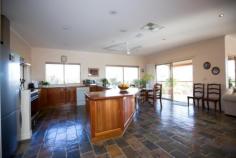 58 Lillecrapp Rd Ilparpa NT 0870 $899,900 ALICE SPRINGS - BREATHTAKING PANORAMA! Possessing impeccable presentation and privacy, this 1.54 hectare property is ready for the thriving family who seek a residence of quality construction and clever design complemented by magnificent views and space. Built in 1999, the double storey residence sits at the end of the gravel drive perched in a scenic setting with the Western Mac Donnells as your backdrop. Take the external stairs to the first floor and pause to see how this home showcases the vistas before you. Then step inside to a wonderful open plan space encompassing a magnificent kitchen, walk-in pantry, informal dining and extended living room. With double glass doors to each of the forward balconies and extra-large windows surrounding the floor, healthy natural light and a cool breeze will never be in doubt. The Tasmanian Blackwood kitchen is ready for the master chef in you. Extensive bench tops and cupboards together with a walk in pantry will ensure this will be a popular spot to chat and cook. Dinner will be a pleasure taken at any of the alfresco spots inside or out or in the formal dining room on the eastern side. The impressive master bedroom features larger glass windows guaranteeing this to be a real room with a view. A delightful ensuite and roomy walk in robe will be well received. Hallway storage, powder room and a rear verandah overlooking the pool and out to the ranges complete the first floor tour. Down the timber internal stairs to the family zone of the home. Three more bedrooms, a spacious bathroom with sunken bath and airy laundry surround the tastefully tiled living room. Summer entertaining from here will be a must with an inviting pool and waterfall in a unique bush setting not far from the door. The virtues of this property continue with a separate elevated one bedroom home a short walk from the main residence. Verandahs front and rear, parking and slate floors make this a comfortable abode for family, friends or a paying tenant. A large 9 x 6m powered shed with three phase power, a double garage and an additional carport will provide parking for the family vehicles or a tradesman's equipment. With nearly four acres on offer, the current owners have carefully designed the landscaping and reticulation to produce a stunning array of native plants and shrubs. Effort has been made to contour the block to protect the paths and plants. A vegie patch has provided regular plants and herbs to the kitchen. If all this is not enough to excite you, then you must take the time to visit this wonderful property as there is so much more on offer. Land Size: 1.54hectares Zoning: Rural Living Year Built: 1999 Council Rates: $1137pa Rental (est): $900 - $950p/w Other features: Built-In Wardrobes,Garden,Secure Parking,Formal Lounge,Separate Dining,Terrace/Balcony 5 bedrooms 2 bathrooms 8 car parks Land Area 1.54 hectares Car Parks: 4 Double garage Double carport Swimming Pool Air Conditioning