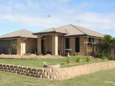 10 Trochus Ave Zilzie QLD 4710 $390,000 Hot to trot ! Selling at less than what it cost! This 3 YEARS YOUNG home awaits your inspection. The owners are moving South and keen to get going. A well designed, AS NEW, low set brick veneer set on a level, privately fenced,low maintenance allotment in beautiful Zilzie.The main bedroom features quality tiled ensuite and walk-in wardrobe. All FOUR bedrooms have built-ins. A great feature is the separate media room opening from the open plan tiled living area. Another unique feature is the drive through double car garage via a single rear roller door to the backyard.The outside Patio is a favourite place of the current owners, a place you will soon be able to relax and enjoy. Embracing the beautiful sea breezes this delightful home would suit retirees or a young family wanting to start out in a new home completely finished. Why not make an offer. Phone Donna Kirkland at Century 21 Solutions on 0408 265 948