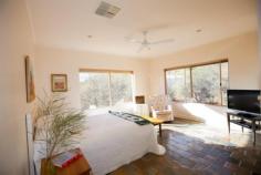 58 Lillecrapp Rd Ilparpa NT 0870 $899,900 ALICE SPRINGS - BREATHTAKING PANORAMA! Possessing impeccable presentation and privacy, this 1.54 hectare property is ready for the thriving family who seek a residence of quality construction and clever design complemented by magnificent views and space. Built in 1999, the double storey residence sits at the end of the gravel drive perched in a scenic setting with the Western Mac Donnells as your backdrop. Take the external stairs to the first floor and pause to see how this home showcases the vistas before you. Then step inside to a wonderful open plan space encompassing a magnificent kitchen, walk-in pantry, informal dining and extended living room. With double glass doors to each of the forward balconies and extra-large windows surrounding the floor, healthy natural light and a cool breeze will never be in doubt. The Tasmanian Blackwood kitchen is ready for the master chef in you. Extensive bench tops and cupboards together with a walk in pantry will ensure this will be a popular spot to chat and cook. Dinner will be a pleasure taken at any of the alfresco spots inside or out or in the formal dining room on the eastern side. The impressive master bedroom features larger glass windows guaranteeing this to be a real room with a view. A delightful ensuite and roomy walk in robe will be well received. Hallway storage, powder room and a rear verandah overlooking the pool and out to the ranges complete the first floor tour. Down the timber internal stairs to the family zone of the home. Three more bedrooms, a spacious bathroom with sunken bath and airy laundry surround the tastefully tiled living room. Summer entertaining from here will be a must with an inviting pool and waterfall in a unique bush setting not far from the door. The virtues of this property continue with a separate elevated one bedroom home a short walk from the main residence. Verandahs front and rear, parking and slate floors make this a comfortable abode for family, friends or a paying tenant. A large 9 x 6m powered shed with three phase power, a double garage and an additional carport will provide parking for the family vehicles or a tradesman's equipment. With nearly four acres on offer, the current owners have carefully designed the landscaping and reticulation to produce a stunning array of native plants and shrubs. Effort has been made to contour the block to protect the paths and plants. A vegie patch has provided regular plants and herbs to the kitchen. If all this is not enough to excite you, then you must take the time to visit this wonderful property as there is so much more on offer. Land Size: 1.54hectares Zoning: Rural Living Year Built: 1999 Council Rates: $1137pa Rental (est): $900 - $950p/w Other features: Built-In Wardrobes,Garden,Secure Parking,Formal Lounge,Separate Dining,Terrace/Balcony 5 bedrooms 2 bathrooms 8 car parks Land Area 1.54 hectares Car Parks: 4 Double garage Double carport Swimming Pool Air Conditioning