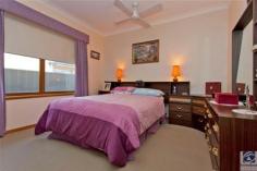 4 Gordon St Wodonga VIC 3690 $349,000 SOLID CENTRAL CHARMER 3 2 5 Only 500m from the Water Tower in the centre of Wodonga you will be surprised to find this charming 3 bedroom home with 2 bathrooms. 4 Gordon Street is a very practical home in every sense, from the modern kitchen to the powered workshop, it offers a lovely sanctuary for all who enter. Vinyl floating floors, warm wood tones throughout and a lovely, low maintenance garden come together to make this one very attractive home. The master bedroom, at the rear of the home, has a delightful ensuite & walk in robe. Both of the other bedrooms are generous in proportion & each offers built in robes. Having a large lounge with separate dining area & an additional living area adjacent to the kitchen means that you have options on how to use each room – depending on whether you have children that you need to escape from. The decor of the modern kitchen is light & neutral in tone and is complemented beautifully by the deep warmth of the wood-look flooring. A double glass sliding door from the family room opens out to a paved verandah that is a fantastic sun catcher on those crisp winter days. For the handy man or woman, the original garage at the rear of the property makes an ideal workshop with power & a roller door. For outdoor entertainment you have both covered and open areas complimented by a cute fish pond and gorgeous garden, all easily accessed by steps or a ramp. Too many cars? This property may suit your needs with a double enclosed carport at the front, room for 2 cars undercover directly behind this and the garage/workshop if required. With sports facilities just down the road an afternoon watching a match, keeping fit or walking the dog is definitely on the cards. Don’t miss the opportunity of owning this solid home in a great location. Additional information Property Type House Property ID 11042100297 Street Address 4 Gordon Street Suburb Wodonga Postcode 3690 Price $349,000