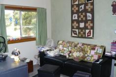 148 Sloping Main Dr Sloping Main TAS 7186 $200,000's PERFECT BEACH HOUSE Over the road from the calm waters of Sloping Main Beach, this comfortable, spacious home has been lovingly maintained and the garden is a joy. With three bedrooms, one of which is currently used as a sitting room enjoying direct access to the rear deck, this low maintenance home has a separate sewing room and a generous living area warmed by a wood combustion heater. The bright, sunny kitchenette has water glimpses of Frederick Henry Bay and a sliding door onto the front deck. Big double carport, workshop, potting house, aviary, studio or sleep-out are among the many other improvements. There is a second vehicle access perfect for your boat. The wood shed is complete with 3 years supply of dry, cut to size firewood for the wood heater. The easy to maintain garden is delightful and attracts a myriad of bird life. Backing onto farmland and just across the road from the beach, this property is well worth a look. Other features: Fireplace(s),Garden,Terrace/Balcony