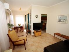 31 Fowles St Barmera SA 5345 Here's a Smart Buy to Invest or Nest! Here is the perfect opportunity for a young couple just starting out or maybe the mature couple ready to retire, or even the single person starting over. This property may seem small and compact but will be perfect for the budget buyer looking for a pre-loved home that will be easy to maintain and is value affordable buying. The large front windows allow natural warmth of sunlight to filter through and security screens are to the windows to add peace of mind. The second bedroom room has a ceiling fan, carpet and louvre windows that has the flow through sunroom or utilise as a study. The kitchen has an electric stove, floor and overhead cupboards, hexagon island bench for extra bench space, and nearby is the open plan diner and lounge. The lounge room with easy care vinyl flooring, slimline venetians and reverse cycle split system provides for added comfort on those lazy stay at home nights, and staying up late with the T V still on wont be a problem with your two kilowatt solar system to decrease the power bills. Bathroom incorporate shower, vanity unit and the mosaic tiled floor laundry has a stainless steel tub. On the back of the home is a full length paved veranda, perfect for undercover entertainment and a good sized lockable shed will be perfect to tinker in for a workshop or use as storage. The large, easy care allotment has rear lane access through double gates and has decorative ornamental splashes of colour with a lushest green lawn. This home is priced well and has a multitude of new beginnings; - it's now ready to sell!