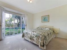 54 Earl Cres Bannockburn VIC 3331 $429,000 - $469,000 Privacy and Location - 1692mt2 Approx Great position and space for the whole family to enjoy. This well cared for home with bull nose verandah sits on a lovely 1692mt2 approx parcel of land with mature trees and gardens giving you ample privacy. The home comprises three bedrooms, two with BIR's and master bedroom with feature bay window, WIR and ensuite. The formal living area features dado timber walls and overlooks the lovely gardens. The dining area, with solid fuel heating, dado walls and raked cathedral ceiling, adjoins the timber kitchen with slate floors, electric cooking and pantry. The bathroom has a fantastic corner spa bath and timber vanity. Outside there is plenty of room to move, single carport at the rear of the home and a single powered and concreted garage. This property will not disappoint, call today to arrange an inspection.