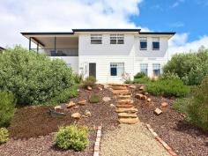 10 Virgo Parade Sellicks Beach SA 5174 $465,000 - $495,000 Coastal Classic Only five minutes form the beach, just walk out the front door and you can see the sea. This home is well presented inside and out. Suitable for living or holiday rental. Plenty of off street parking. 47 minutes to Adelaide Railway Station and 16 minutes to Seaford Railway Station. Beach style home in excellent condition. This home has the accommodation space for a large family, four double bedrooms all with built in robes. and 2 separate living areas upstairs and down plus a storage room. Balcony views of the coast as far as Aldinga can be enjoyed from a spacious balcony or while you're preparing a meal in the kitchen. All of the home enjoys great natural light with large windows a feature. All of the bedrooms are above average size, the master bedroom has walk-in robe and ensuite and there is plenty of storage space throughout the home( check the floor plan). Both front and back gardens have been beautifully landscaped with stone paths and retaining walls and from the back of the home there is rural outlooks that are uninterrupted. This is a must see home that has little if anything to do except relax and enjoy. Over 60 Wineries in and around McLaren Vale. Heaps of restaurants. One of South Australia best beaches. Most attractions with 50 minutes including Tailisker Conservation Park. 50 minutes to Victor via Hindmarsh Tiers.