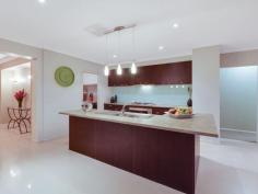45 Viewgrand Blvd Epping VIC 3076 Sensational Family Entertainer! Built to the highest standards with no expense spared, this spacious contemporary home of 36sq (approx) offers formal and informal living spaces. The magnificent kitchen has 900mm Blanco s/steel appliances, dishwasher & butlers pantry overlooks the spacious living area, rumpus room and out to the large alfresco area and stunning heated outdoor spa. 4 large bedrooms with BIR's master with full ensuite & spa, WIR plus study or 5th bedroom. 3 separate living zones, heating & cooling, CCTV alarm system, landscaped gardens, alfresco area, spa and 2 designer bathrooms.