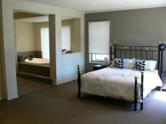 68 High St Marong VIC 3515 $430,000 - $445,000 Spacious 32 Square Exective Style Home Located in increasingly popular Marong is this large modern B/V executive style home offering approx. 32 squares of very comfortable living. Features include 4 large bedrooms with built in robes with the main offering a walk-in robe, 3 piece bathroom/on suite with separate toilet, double vanity, spa bath and private courtyard, study, 3 living areas & dining off the kitchen including the theatre room at the rear of the house, and 9 foot ceilings. The stylish kitchen features a fantastic SS 5 burner gas range, rangehood, dishwasher, walk-in-pantry, space for double door fridge and a breakfast bar. Ducted zoned heating/cooling provides year round comfort. Outdoors find a double garage with internal access, alfresco and vehicle access to the rear yard which offers plenty of space for a large shed. Securely fenced on approx. 1000 sq m block and very well presented, this home offers a semi-rural aspect yet walking distance to kinder/school, secondary school bus stop, milk bar and local pub, all this just 15 minutes from the Bendigo CBD. Property Snapshot Property Type: House Construction: Brick Veneer House Size: 32.00 m2 Land Area: 1,000 m2 Features: Built-In-Robes Close to schools Close to Shops Courtyard Dishwasher Ducted Heating Ensuite Garden Shed Gas Lounge Outdoor Living Remote Control Garaging Spa Storage Study Undercover Entertainment Area Walk in Pantry Walk-In-Robes