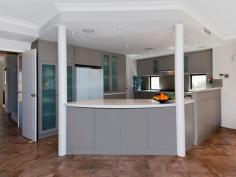 2 Monte Carlo Heights Port Kennedy WA 6172 $895,000 Two Homes in One..! Located in a sheltered spot in the Ocean Edge estate approx. 250m from award winning Warnbro Beach, this superb home has a massive 420sqm of living area extending over 3 levels on a generous 707sqm block. It is like 2 homes in 1. The main living area has a huge open plan family & dining area which is adjacent to a large chef's kitchen & breakfast bar. There are 3 spacious bedrooms the main with custom robes - 2 ensuite bathrooms and a ground floor powder room. An attached guest quarters/granny flat has a huge bedroom, ensuite bathroom, lounge/living room and kitchenette, and can be accessed either internally or externally from the main house, so privacy is assured. A feeling of spaciousness is enhanced by a void over the family area, and high ceilings throughout the ground floor. The main living areas overlook a stunning b/g pool wrapped around a gazebo, nestled in a beautiful landscaped garden. Unwind to the sound of water splashing down the pool's waterwall and rising from the bubblers close to the gazebo's bridge. Or go to the movies in the fully equipped home theatre room. There is also a large ground floor home office just off the front entry, a huge, 30 sqm loft accessed by the 2nd staircase, and a large storage space/wine cooler under the main staircase. A "Webb & Brown Neaves" house, it is well built and has quality fittings throughout. It is cooled & heated by 2 separate reverse-cycle, ducted A/C units with another reverse-cycle A/C unit in the loft. Curtains and pelmets frame the windows in all living areas and bedrooms, and floors have lovely woollen carpet or porcelain tiles. There is a fully monitored security system, smart-wiring and an integrated entertainment system that plays music throughout the main house & outside entertainment area as you chose. Secure parking is provided by the 2 and a half car-sized garage. Storage space abounds throughout the house and garage.
