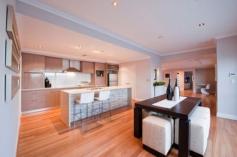 5 Harlequin Pass Southern River WA 6110 $950,000 - $980,000 This elegant and contemporary 4 bedroom, 2 bathroom family home, built by Sovereign Building Company, was an entry in the 2009 HIA-NAB Perth Housing Awards. The modern residence is built over two levels and features a practical floorplan and quality designer finishes throughout. The corner home has a striking street elevation which is highlighted by a huge landmark palm tree. As you enter the house, the wide timber-floored entrance flows past bedroom 4/study to the spacious open-plan living with computer nook and onto the dining area and kitchen then the separate home theatre room. Bi-fold doors open to extend the living room to a poolside alfresco area, which has a built-in kitchen with a pizza oven and is perfect for entertaining. Back inside, you will love the large modern kitchen with island bench which looks out across the dining and living area to the pool and alfresco area. The chefs kitchen includes stainless steel appliances, glass splashback, double sink, appliance cupboards and double door pantry. Off the kitchen is the laundry which has plenty of storage space and stone benchtops. In a wing of their own are the two well proportioned minor bedrooms, each with built-in robes. They share a fully tiled bathroom with twin basins, stone benchtop, spa bath, shower and separate toilet. There is plenty of storage in the house with two large linen presses in this wing. Upstairs, a big balcony is accessed from the landing. Along with city views, it offers a place to enjoy morning coffee, a sunset drink or watch the city fireworks show, with its own benchtop, sink, fridge recess and cupboard. The main suite has an abundance of natural light, a generous walk-in robe and fully tiled ensuite with a shower big enough for two and twin basins. Some of the features you will love about this exceptional home include: o Private grand master suite with walk in robe o Dual basin ensuite featuring floor to ceiling tiling o Grand balcony with city views and outdoor kitchenette o Three well proportioned double bedrooms o Family bathroom with dual basins, spa bath and separate shower o Modern kitchen with feature island bench, huge pantry, lots of cupboard space and stone benchtops o Smeg stainless steel 900mm electric oven, cooktop and rangehood o Generous open plan living area with computer nook o Secluded home theatre o Laundry with stone benchtops and lots of storage o Undercover alfresco area with outdoor kitchen, inbuilt BBQ, pizza oven and café blinds o Swimming pool with water feature o Timber flooring o Reverse cycle air conditioning throughout o Security system for peace of mind o An abundance of storage throughout the house o Double lock up garage with additional storage This beautiful home is located close to Bletchley Park Primary School, parks, public transport and a short drive to the Southern River Shopping Centre and Tonkin Highway. You'll be sure to love this house, so come along to a home open or call to arrange a private viewing.