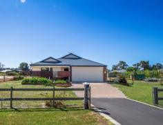 17 Fitzroy Link Vasse WA 6280 $575,000 Property ID: #2941568 PERFECT COMBINATION OF LIFESTYLE AND LOCATION 4 2 2 Here is your chance to live a unique country lifestyle, yet just minutes from popular schools, The Busselton CBD, the beach and all the Southwest attractions. This two year old home is positioned on an idyllic north facing 2015sq m block and is a versatile expression of family friendly living. At the heart of the layout an impeccably presented light filled kitchen adjoins the open plan living and dining area encouraging family gathering and entertaining. Bedrooms are positioned for a degree of privacy and separation and include a plush master bedroom with private ensuite and walk in robe, with three generously proportioned minor bedrooms with built in robes. The north facing park size garden provides heaps of room for entertainment or play and you will soon reap reward from the wide range of fruit trees. Decorated in neutral tones, with easy care durable finishes and built to be extra energy efficient this home offers the promise of country ambience in a convenient location. Other features include: - loads of side access and plenty of room for the future shed - BGC built brick and colourbond home - high efficiency build to reduce energy bills - secure two car garage - wood look ceiling fans throughout - quality fittings and window treatments - 900 mm appliances in kitchen - reticulation to most garden beds Inspection Times 2:00pm - 2:45pm Saturday, 31 October 2015 Land Size 2015 m2