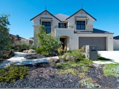 2 Monte Carlo Heights Port Kennedy WA 6172 $895,000 Two Homes in One..! Located in a sheltered spot in the Ocean Edge estate approx. 250m from award winning Warnbro Beach, this superb home has a massive 420sqm of living area extending over 3 levels on a generous 707sqm block. It is like 2 homes in 1. The main living area has a huge open plan family & dining area which is adjacent to a large chef's kitchen & breakfast bar. There are 3 spacious bedrooms the main with custom robes - 2 ensuite bathrooms and a ground floor powder room. An attached guest quarters/granny flat has a huge bedroom, ensuite bathroom, lounge/living room and kitchenette, and can be accessed either internally or externally from the main house, so privacy is assured. A feeling of spaciousness is enhanced by a void over the family area, and high ceilings throughout the ground floor. The main living areas overlook a stunning b/g pool wrapped around a gazebo, nestled in a beautiful landscaped garden. Unwind to the sound of water splashing down the pool's waterwall and rising from the bubblers close to the gazebo's bridge. Or go to the movies in the fully equipped home theatre room. There is also a large ground floor home office just off the front entry, a huge, 30 sqm loft accessed by the 2nd staircase, and a large storage space/wine cooler under the main staircase. A "Webb & Brown Neaves" house, it is well built and has quality fittings throughout. It is cooled & heated by 2 separate reverse-cycle, ducted A/C units with another reverse-cycle A/C unit in the loft. Curtains and pelmets frame the windows in all living areas and bedrooms, and floors have lovely woollen carpet or porcelain tiles. There is a fully monitored security system, smart-wiring and an integrated entertainment system that plays music throughout the main house & outside entertainment area as you chose. Secure parking is provided by the 2 and a half car-sized garage. Storage space abounds throughout the house and garage.