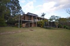 472 Veresdale Scrub School Rd Veresdale Scrub QLD 4285 $550,000 Negotiable WIDE OPEN SPACES AND LOADS OF ROOM WITHIN 5 BEAUTIFUL ACRES. Ideal property for those seeking peaceful living with country views. This outstanding offering to market features an elevated block with a contemporary style home. Designed to maximise the benefits of the property this home includes an Open Plan Living with sunken lounge and cathedral ceilings.The kitchen is fully functional with Freestanding Stainless Steel Cooker, dishwasher and breakfast bench. A sunken lounge takes advantage of the views to the country surrounds and hills beyond with access to the front veranda. The home boasts four bedrooms all with built-in robes, each bedroom is substantial in size with an ensuite and walk-in robe to the Master. Downstairs another living area provides room for children or an additional study area with a large storage room behind. Outdoor entertaining is easily accommodated with paved patio - BBQ area and above ground Pool. A fully self-contained Granny Flat gives living options for visiting relatives or grown up children desiring some privacy. The property includes a 12 x 6m Colourbond Shed for machinery, cars or storage..Complete with two paddocks and plenty of room for pets and children, this property offers a lifestyle choice not readily available to many. Above Ground Pool, Balcony, Broadband, Built In Robes, Courtyard, Deck, Dishwasher, Ensuite, Floorboards, Fully Fenced, Grey Water System, Open Spaces, Outdoor Entertaining, Pay TV, Rumpus Room, Secure Parking, Shed, Solar Hot Water, Split System AirCon, Water Tank, Workshop, PROPERTY DETAILS Price $550,000 Negotiable Property Type House Property ID 2950411 4 2 5