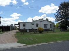 14 Curr Road Stanthorpe QLD 4380 $165,000 Grab this -has to be sold!! Ballandean - just 15 minutes direct drive to Stanthorpe. Sure it needs work but look where it is - the bones are already here to make this a top spot - 3 bedrooms, sep lounge with wood heater + reverse cycle air conditioning, spacious kitchen and family bathroom, great separate family room. Real bonus is the extra large shed ( 12 x 8 x 4.2 high) - to fit trucks - has concrete floor and power! Plus extra smaller sheds for storage/workshop etc, rain water tanks. Great spot overlooking sports oval and open space on easy care 1,151m2 plus easy walk to primary school/ local shop/chemist/post office and Tavern! What a start - asking just $165,000. Sellers have said "Must sell" ...so go for it NOW. This is an opportunity too good to miss! Call Anne Lindsay on 0418737309. Features Indoor entertainment area Safety Switch Fenced Smoke Alarms Property Details Bedrooms 3 Bathrooms 1 Garages 3